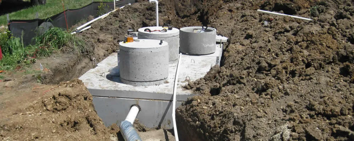 Septic system repair and installation site with tank access ports in Baltimore, MD